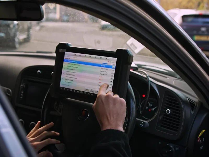Reading stored fault codes on a diagnostic tablet in the cab